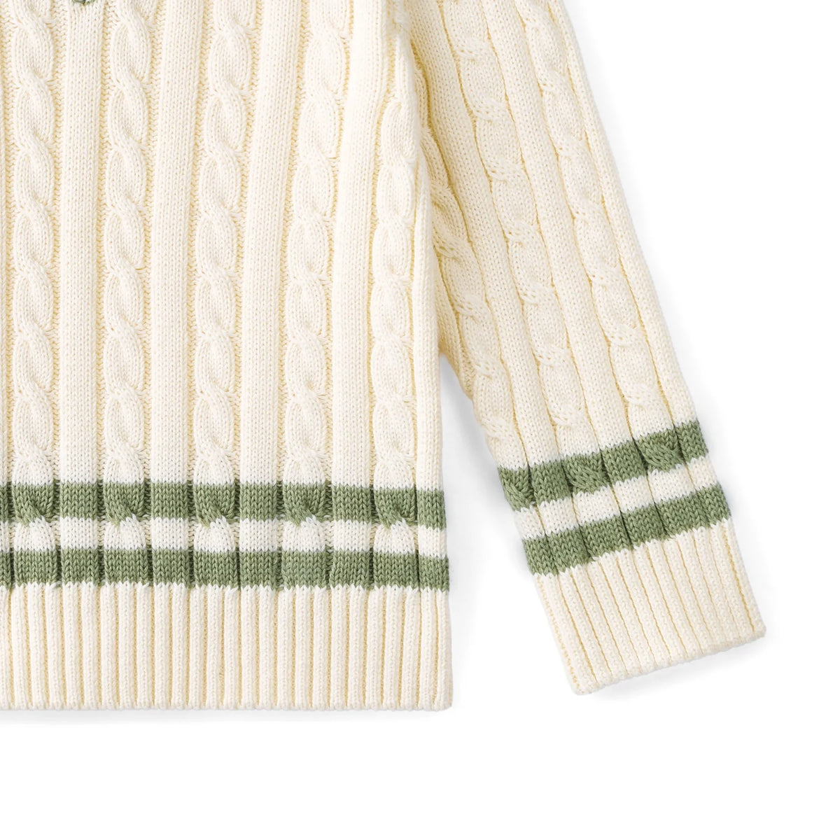Kids cable knit sweater sleeve with cream knit and green striped cuff and hem band
