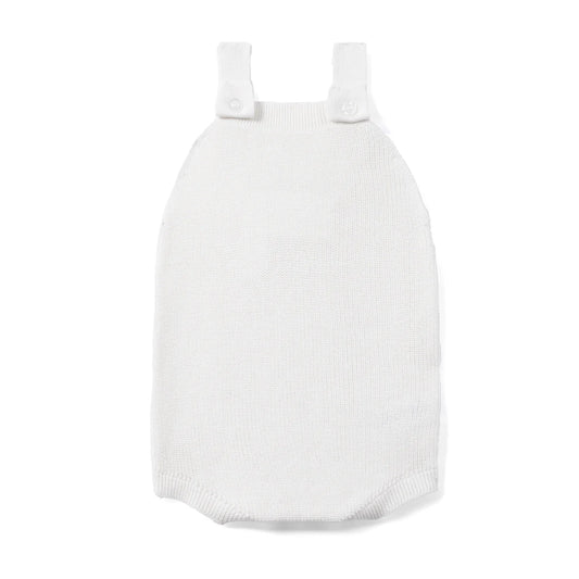 White knit baby romper with button shoulder straps and a sleeveless bodice.