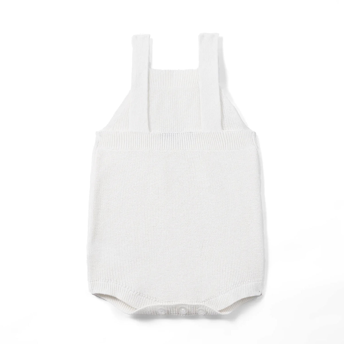 White knit baby romper with button shoulder straps and ribbed leg openings.