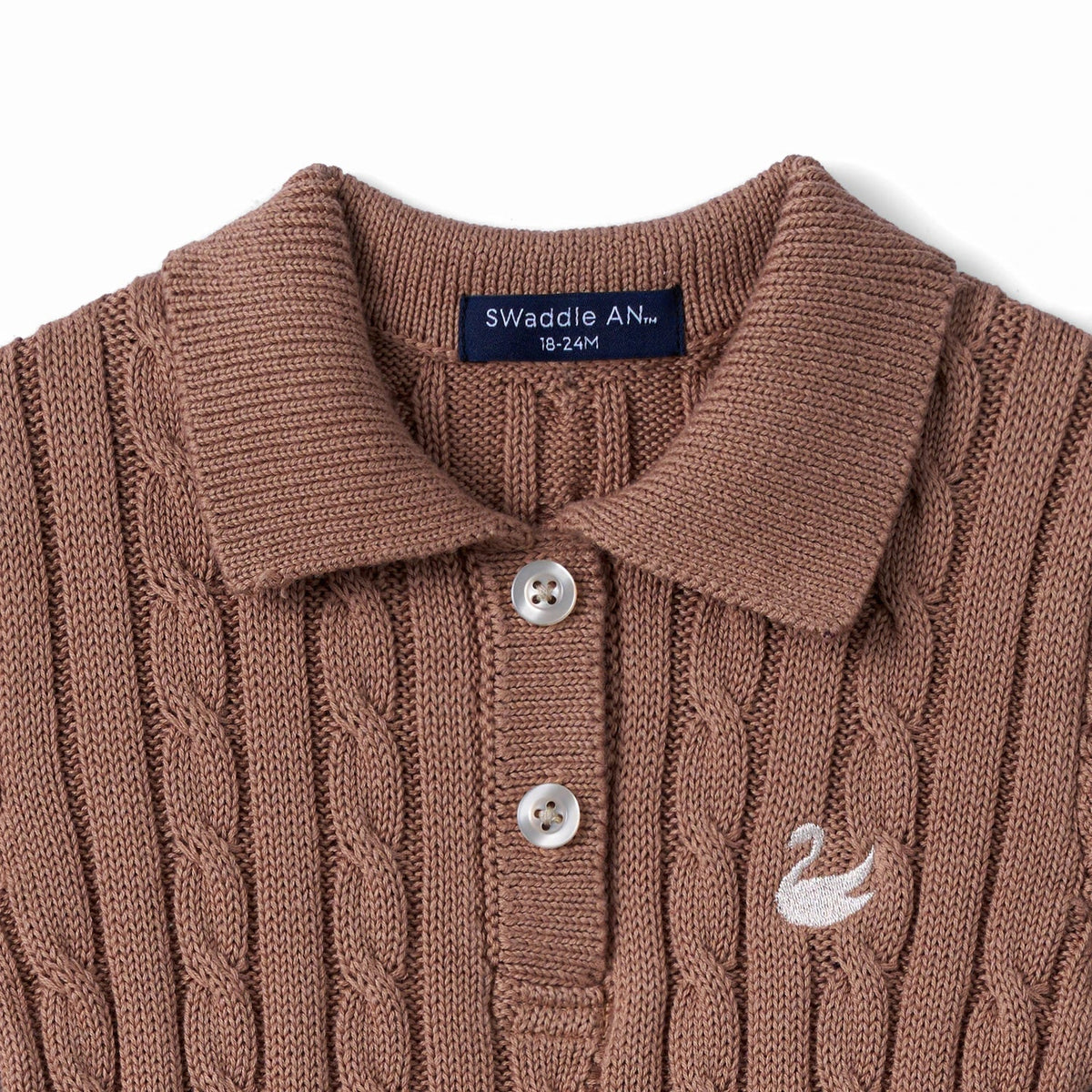 Mocha cable-knit polo dress close-up of ribbed collar, buttons, and swan logo