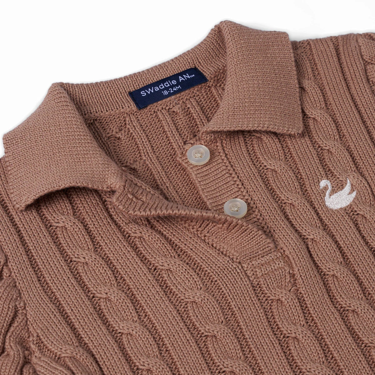 Mocha cable-knit polo dress close-up of knit collar, button placket, and swan emblem