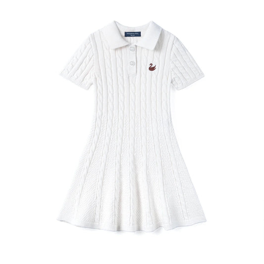 White cable-knit polo dress with short sleeves, button placket, and chest emblem.