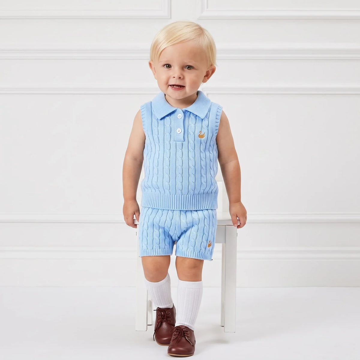 Baby blue cable-knit shorts on a toddler, ribbed elastic waistband