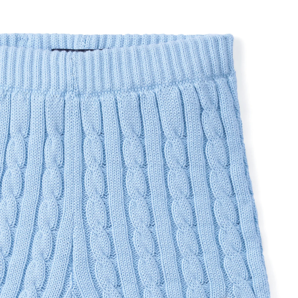 Baby blue cable-knit shorts close-up, ribbed waistband detail
