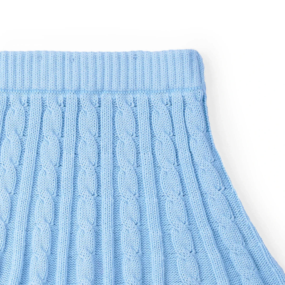 Baby blue cable knit skirt with raised vertical cable pattern and ribbed waistband