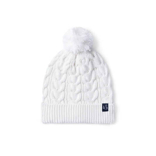 White cable knit baby beanie with ribbed brim and fluffy pom-pom top.