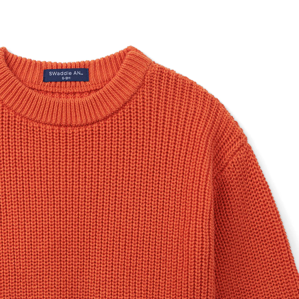 Orange rust knit baby sweater with crew neck and ribbed trim