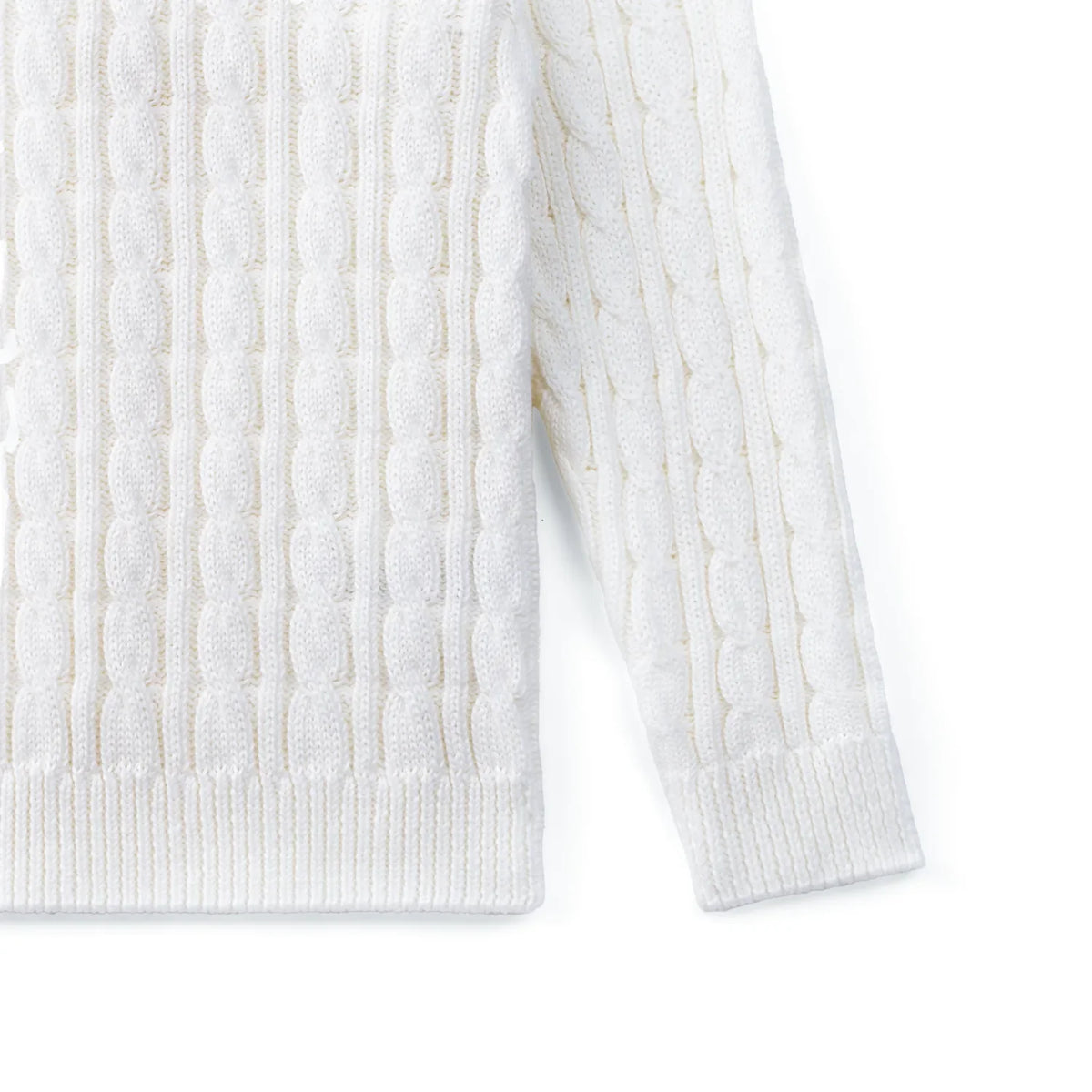 White cable knit baby sweater with ribbed cuffs and hem
