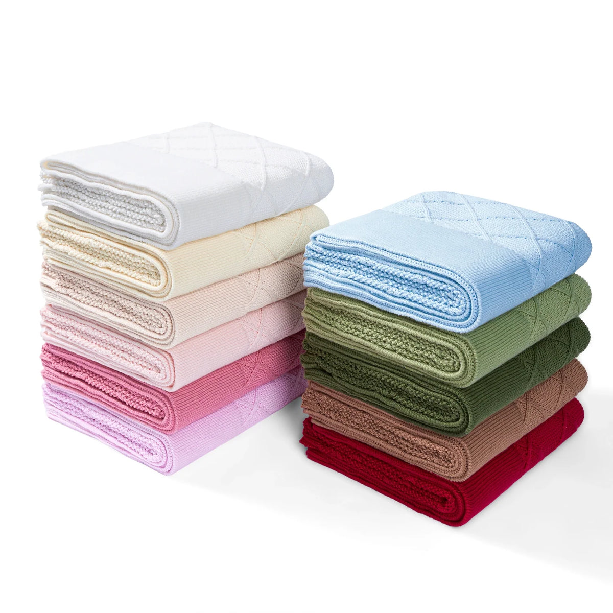 Stack of baby knit blankets in multiple colors, including forest green