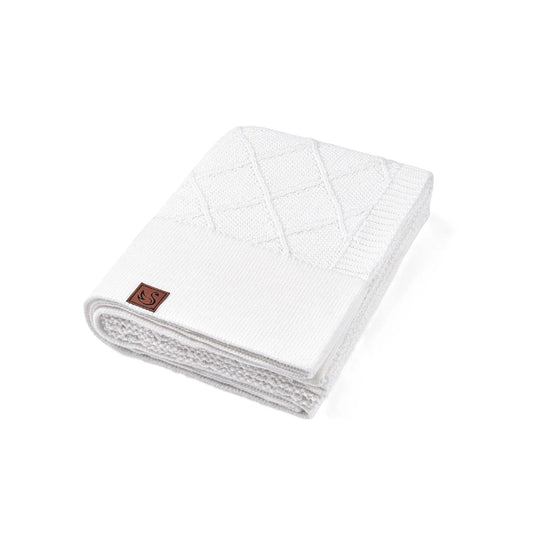 White diamond-stitch baby knit blanket, folded with textured diamond pattern.