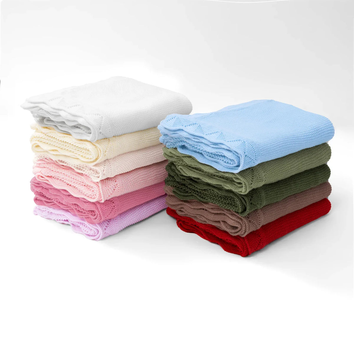 Stack of folded baby knit blankets in assorted colors