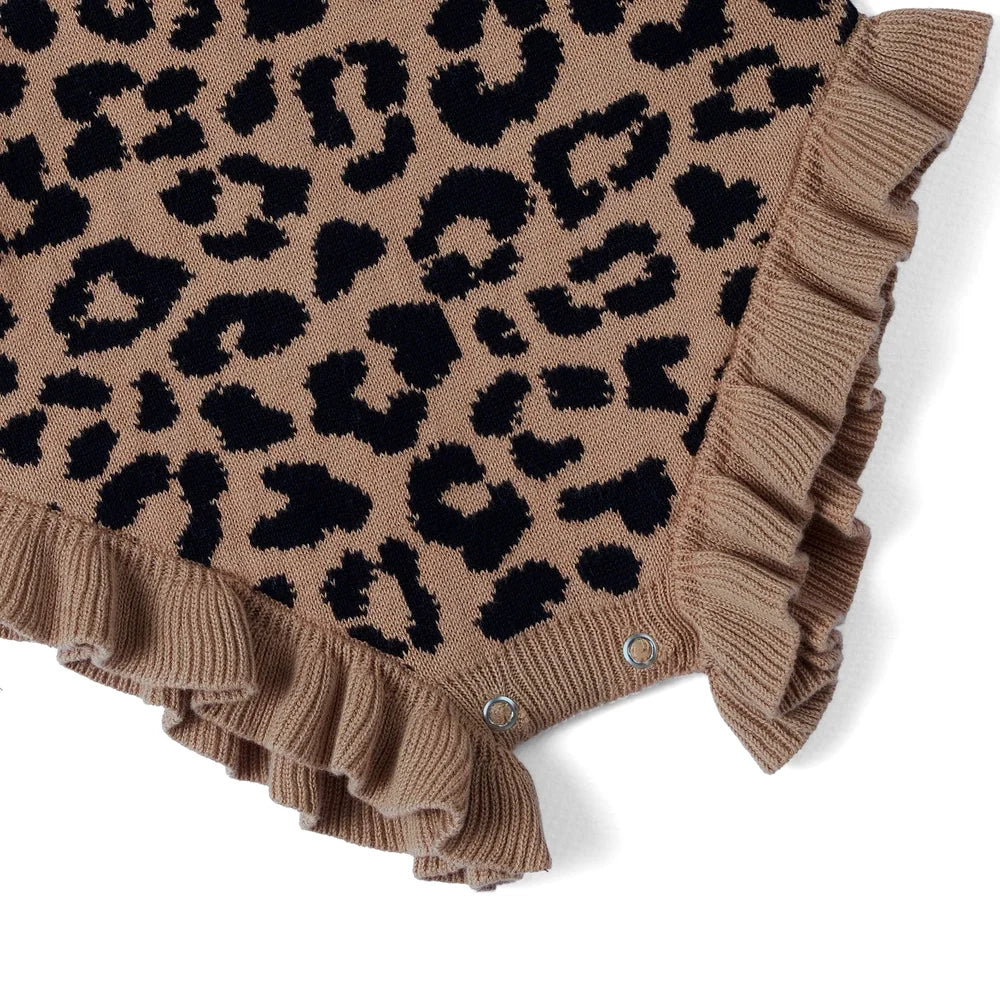 Leopard print knit romper with snap buttons and ruffled hem trim