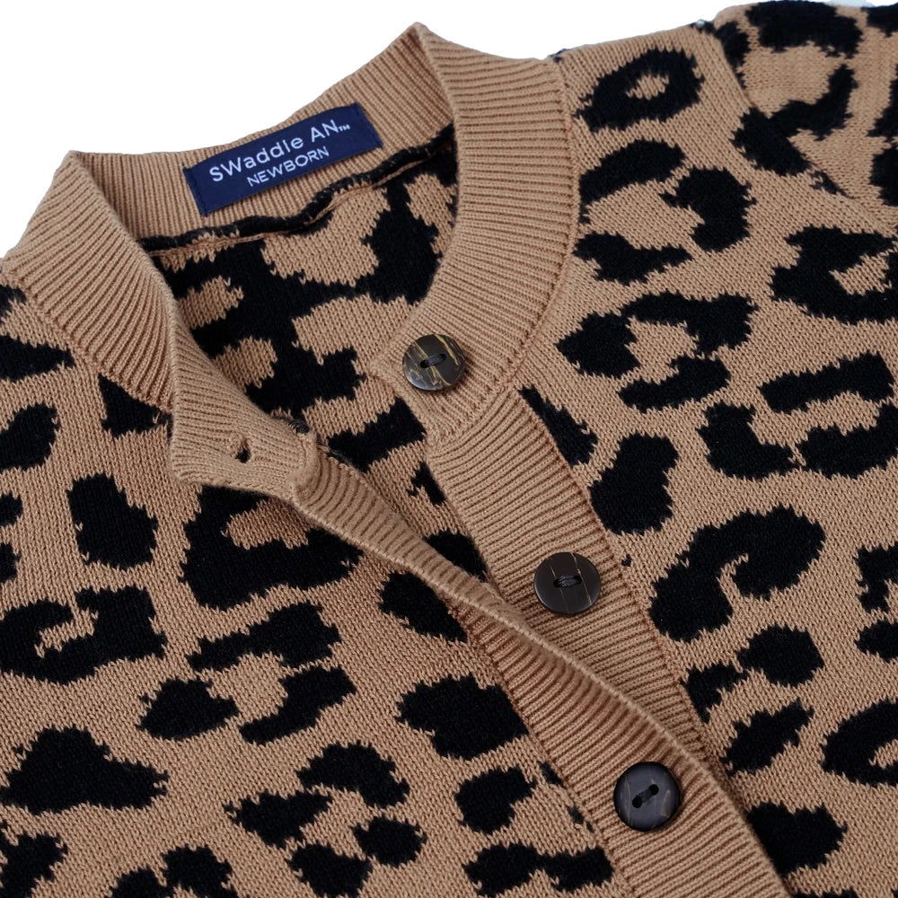 Leopard knit romper close-up of front buttons and ribbed neckline