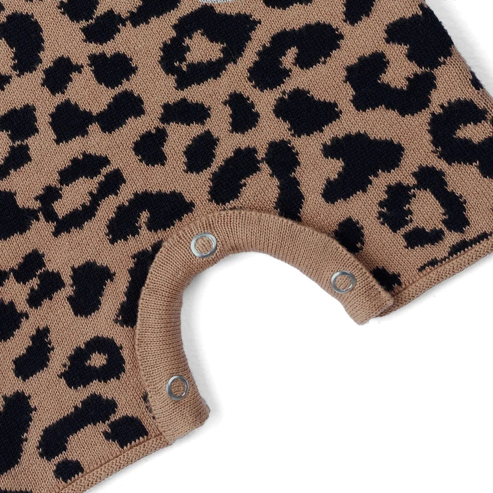 Beige leopard print knit playsuit hem with snap buttons at the crotch