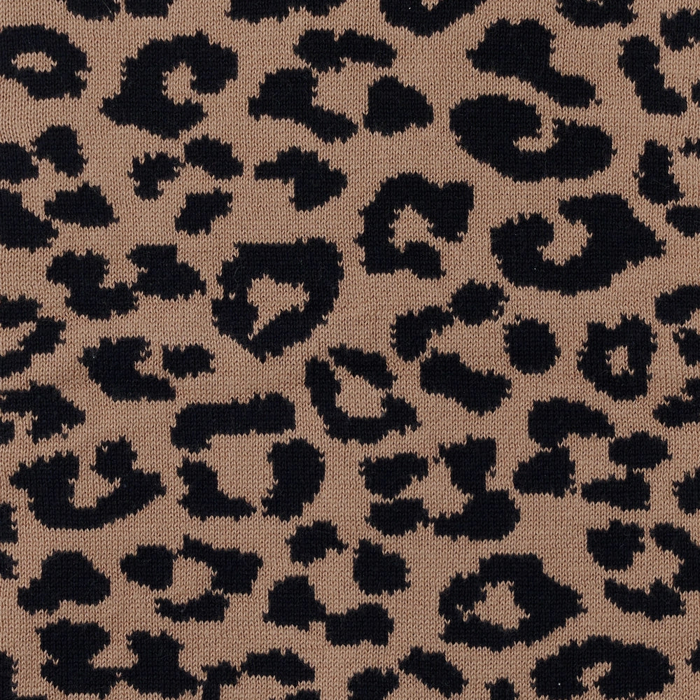 Leopard knitted topknot bow headband fabric close-up, brown and black spots