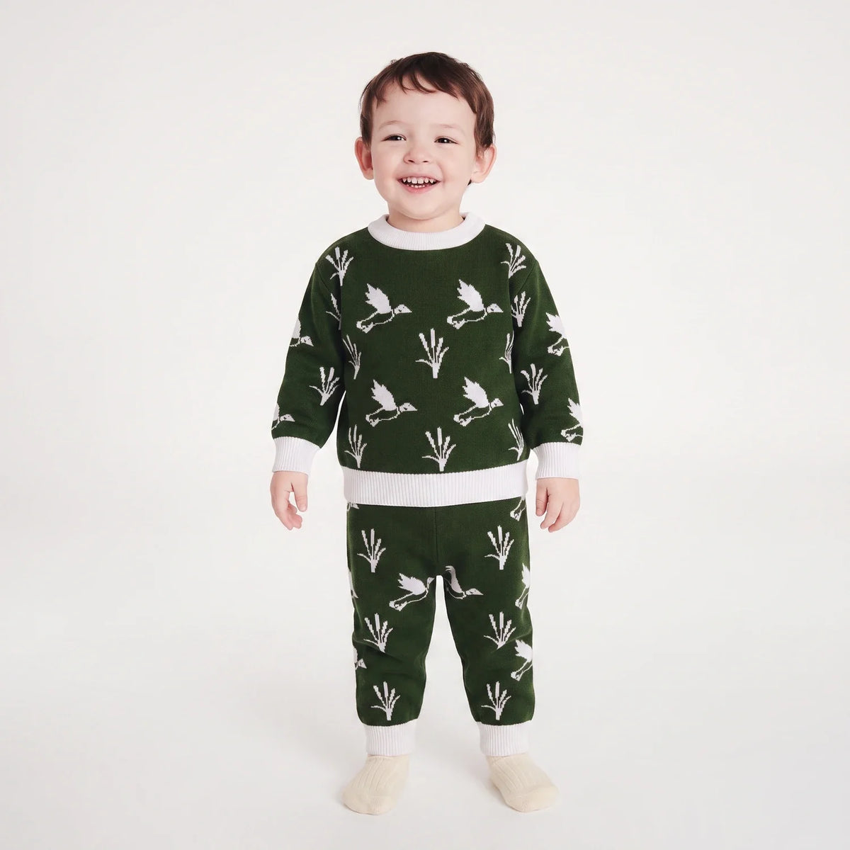 Kids dark green knit sweater and joggers set with white duck and plant print, ribbed cuffs