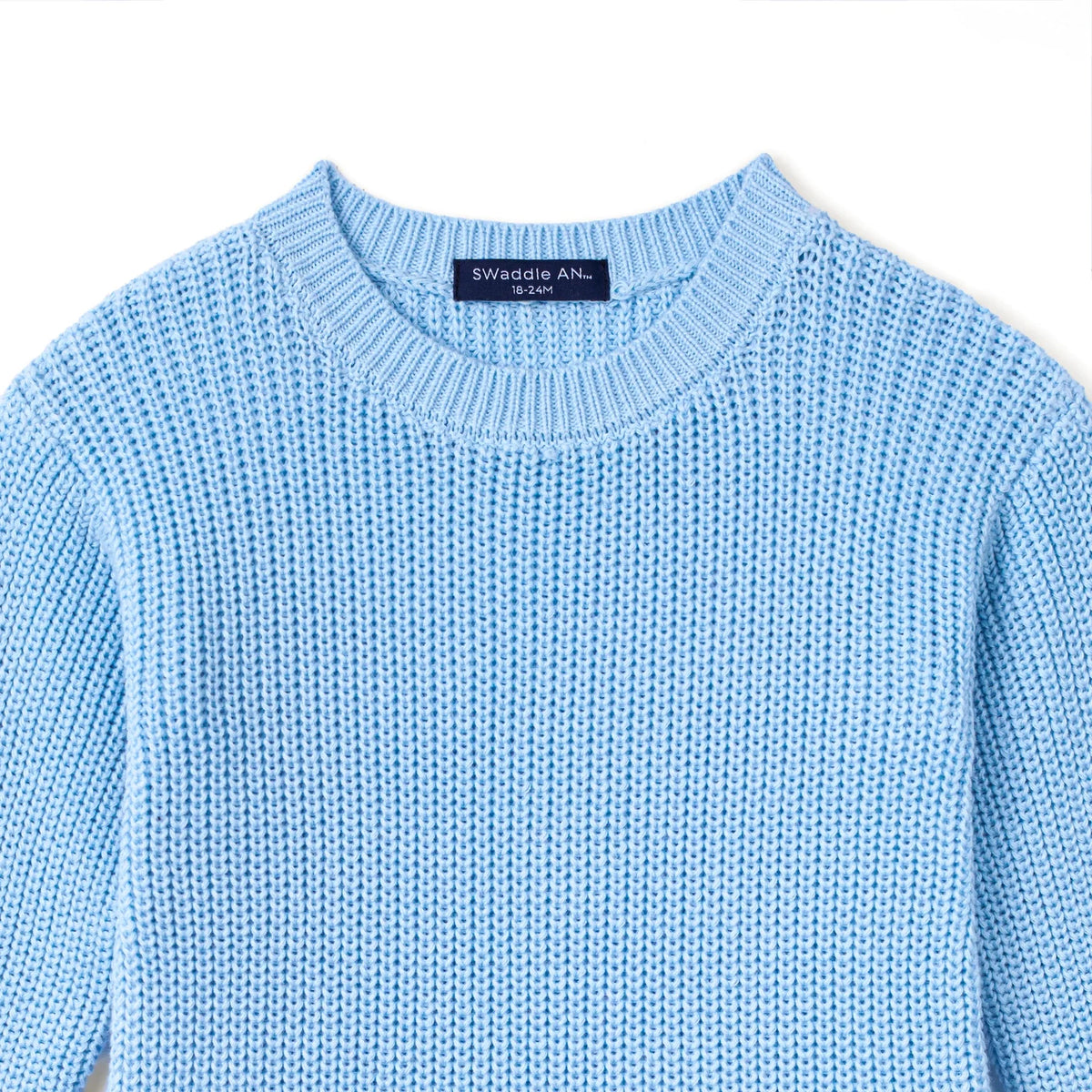 Light blue knit romper with crew neck and Swaddle Anne label