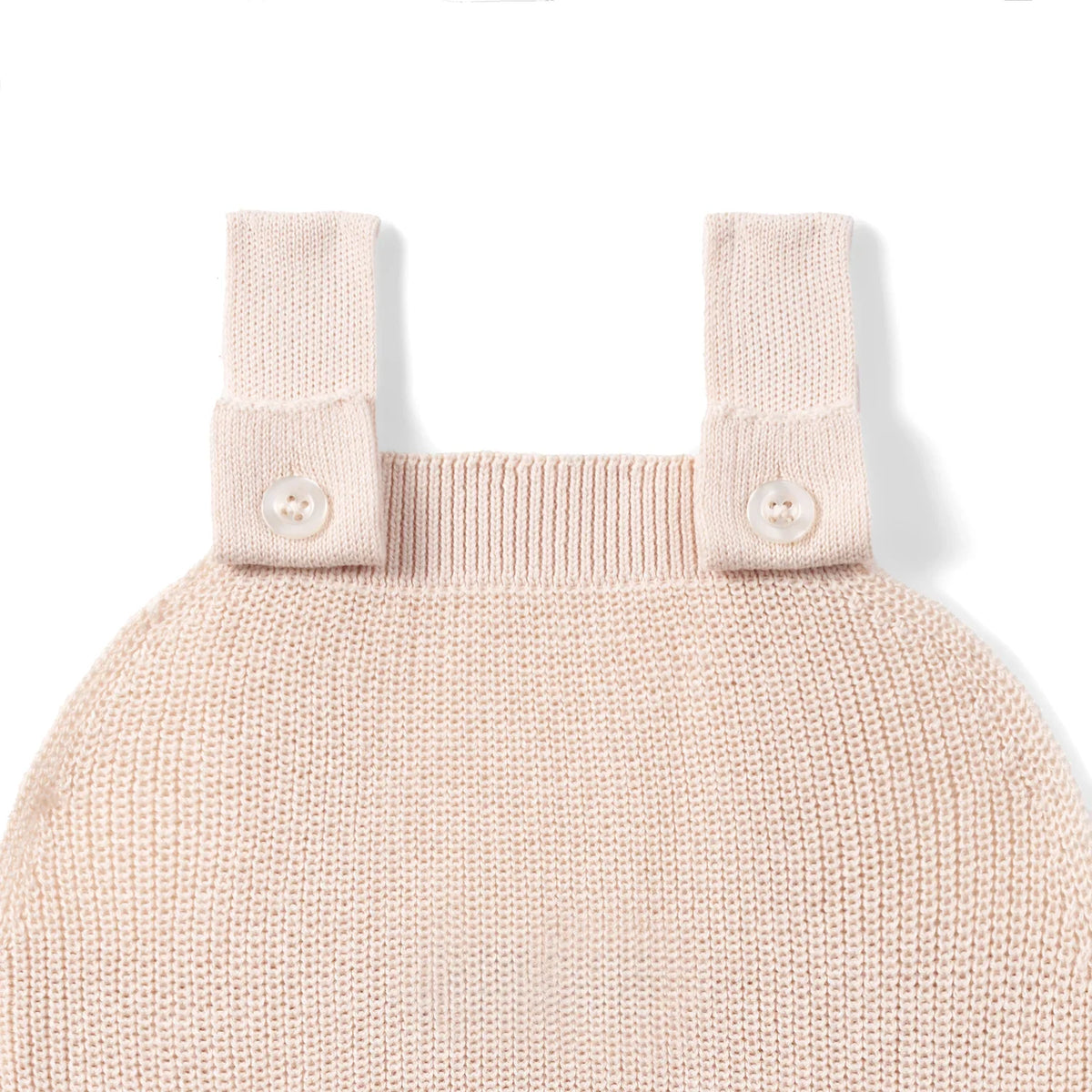 Beige knit romper with two-button straps and ribbed neckline