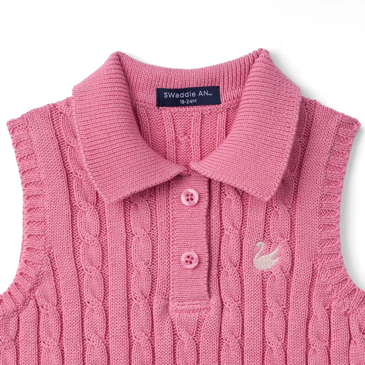 Rose pink cable-knit polo vest with wide collar, pink buttons, and swan embroidery