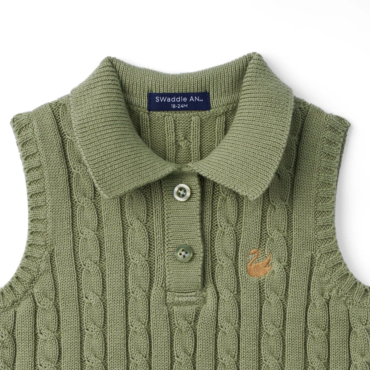 Sage green cable-knit sleeveless polo shirt close-up with ribbed collar and button front.
