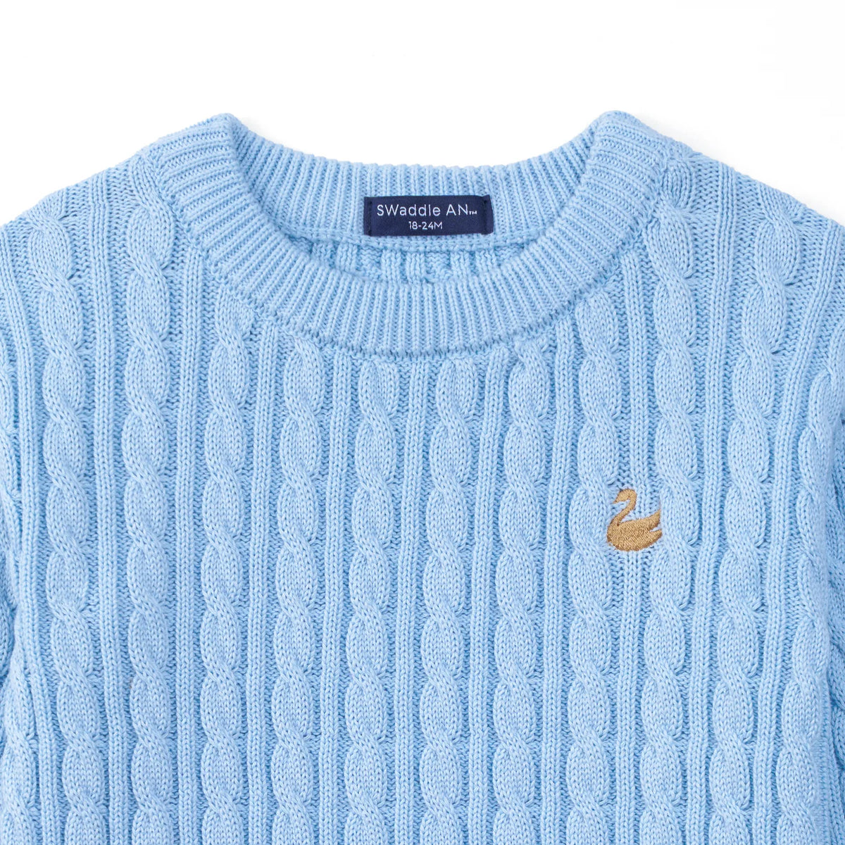 Baby blue cable knit baby sweater with ribbed crew neck and swan logo