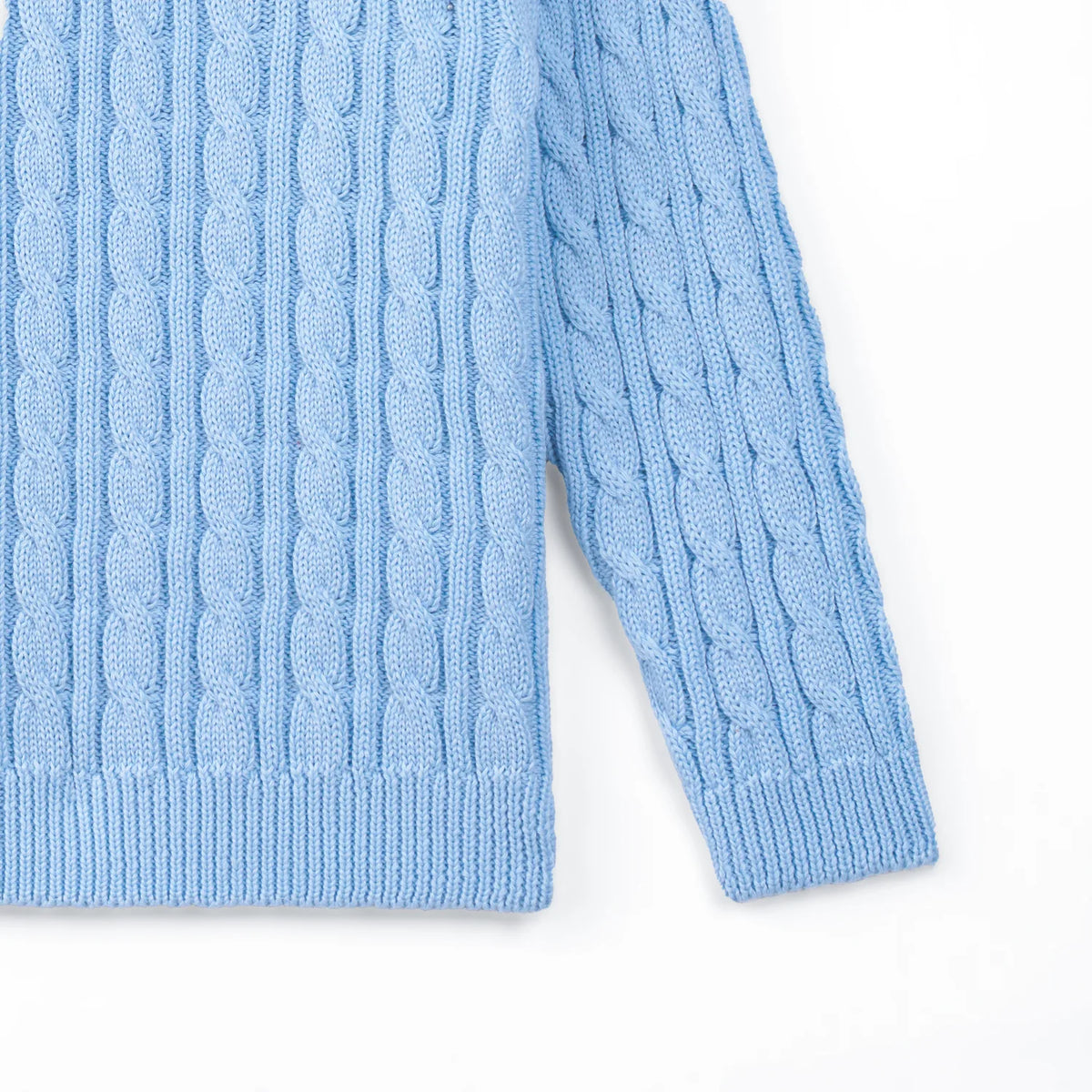 Light blue cable knit baby sweater sleeve with ribbed cuff and hem