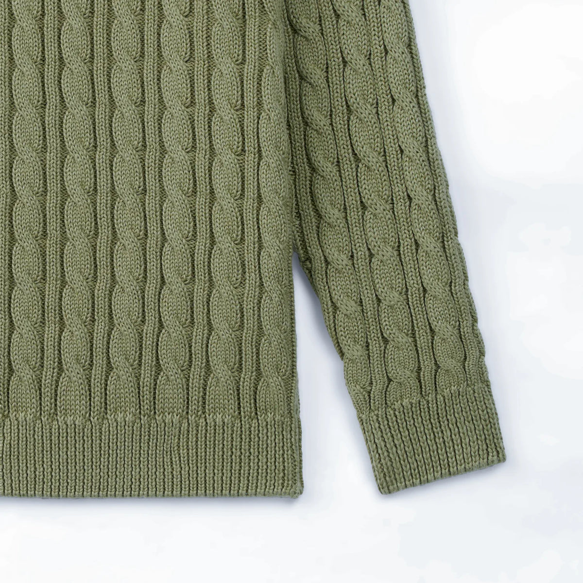 Sage green cable knit baby sweater hem and long sleeve cuffs