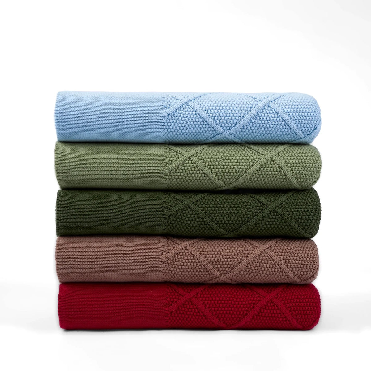 Stack of diamond-stitch knit baby blankets in blue and assorted colors, folded neatly