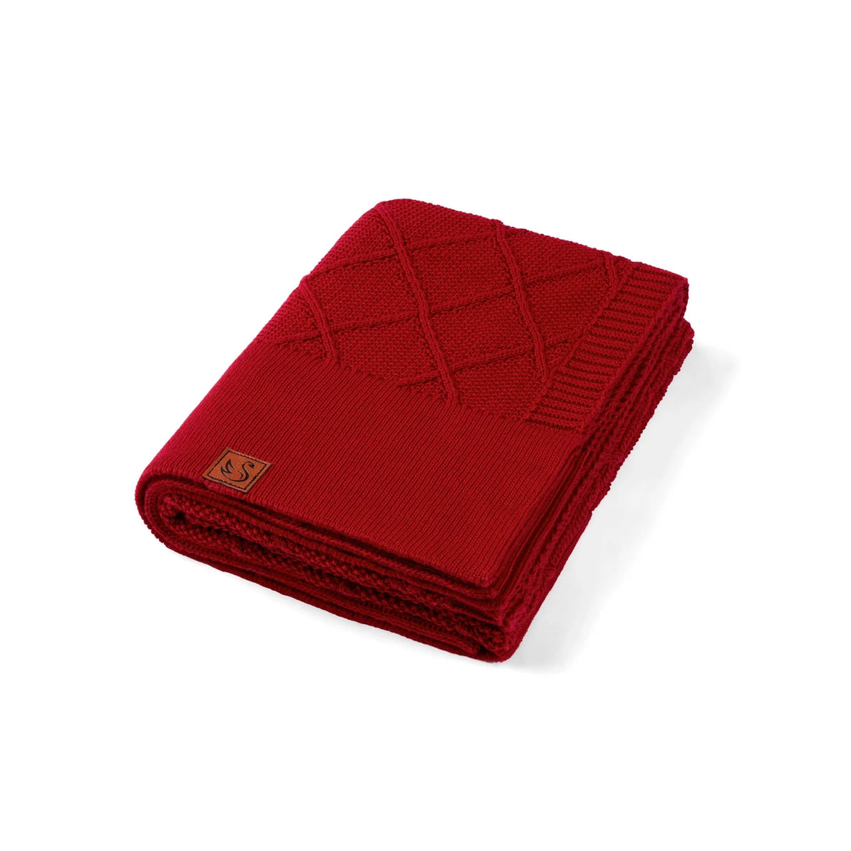 Red diamond-stitch baby knit blanket, folded with stitched grid pattern
