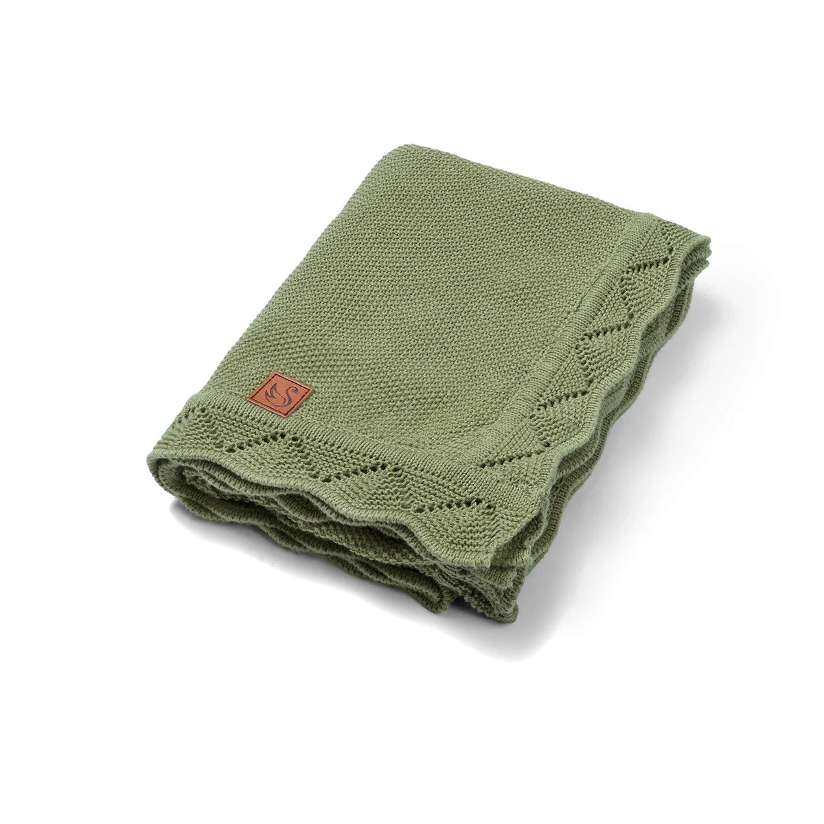 Sage green heirloom lace knit baby blanket, folded with stitched corner patch