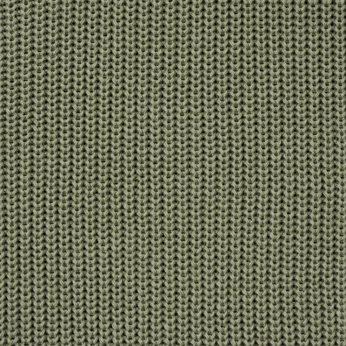 Sage green knit baby sweater fabric detail, dense textured stitch pattern.