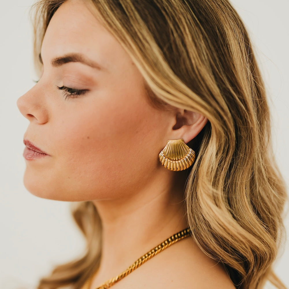Gold scalloped shell hoop earrings with ridged fan details