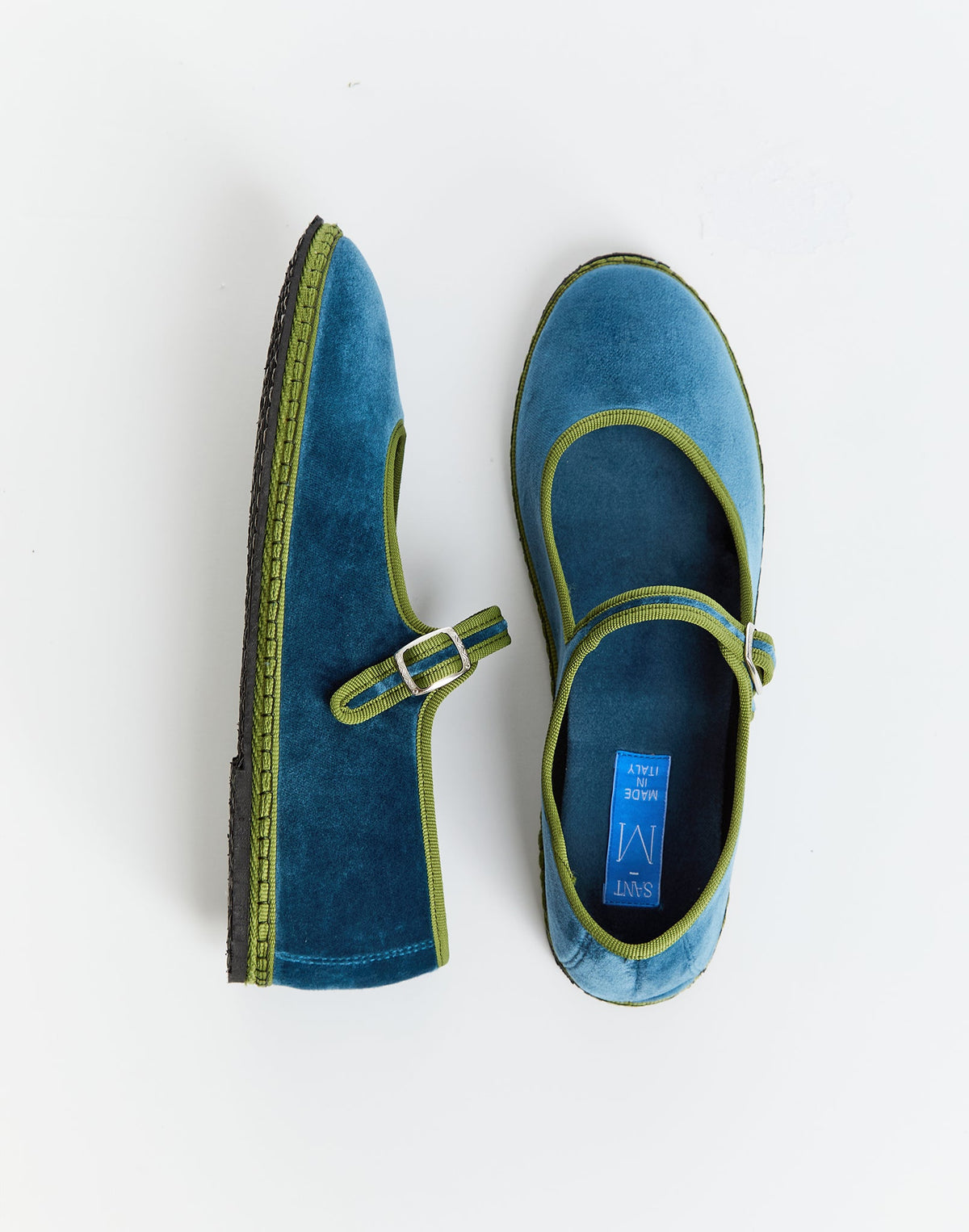 Blue Mary Jane shoes with green trim and strap, side view of two pairs
