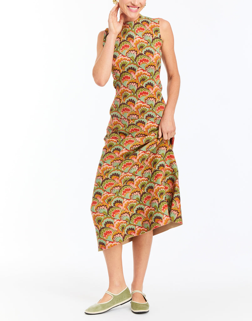 Sage green Mary Jane flats with ankle strap, worn with a midi dress