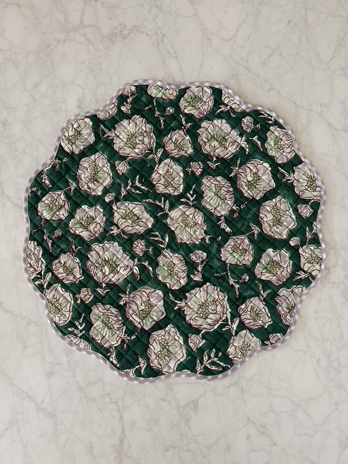 Emerald placemat with quilted floral print and scalloped edge