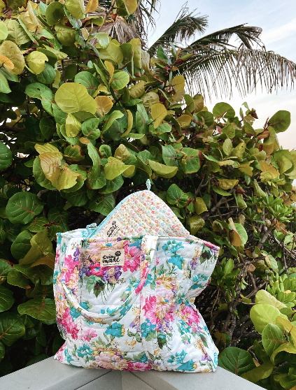 Floral zip tote bag with top handles and looped drawstring, pastel floral print