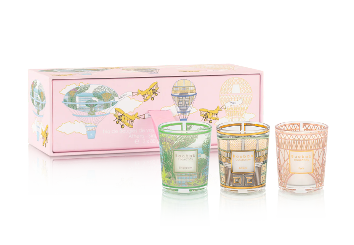 Trio travel candles in patterned glass jars with lid-like rims: green, amber, pink, and gift box