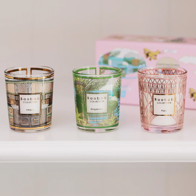Trio travel candle jars with Baobab labels in green, gold, and pink patterned glass