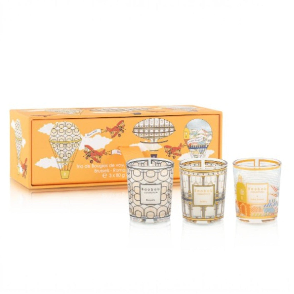 Baobab Collection trio travel candles in metal tins with illustrated labels, in orange box