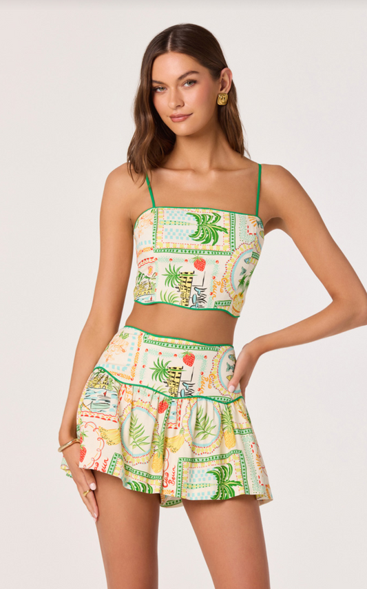 Farm print shorts with green trim, elastic waist, and ruffled hem