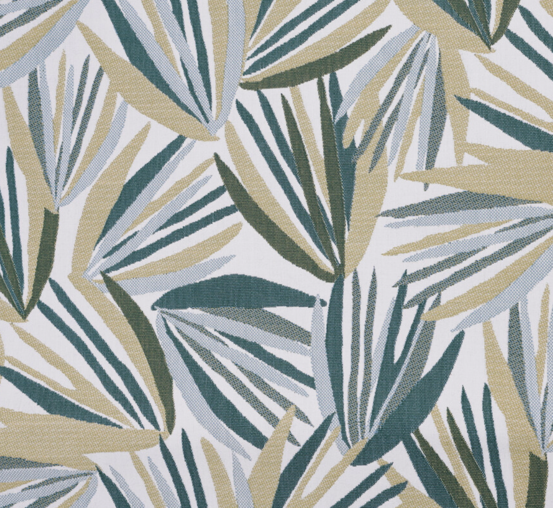 Throw pillow cover fabric shows dense tropical leaf print in teal, green, and cream tones.