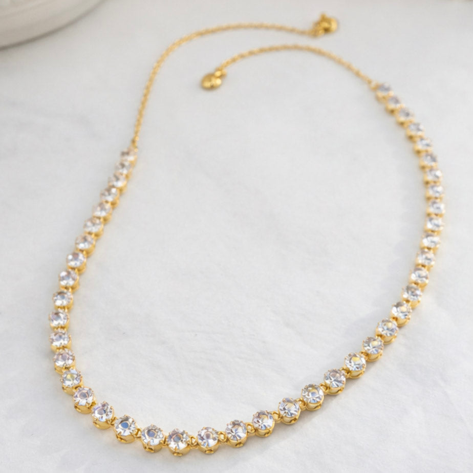 Gold-tone tennis-style choker necklace with clear rhinestone stones
