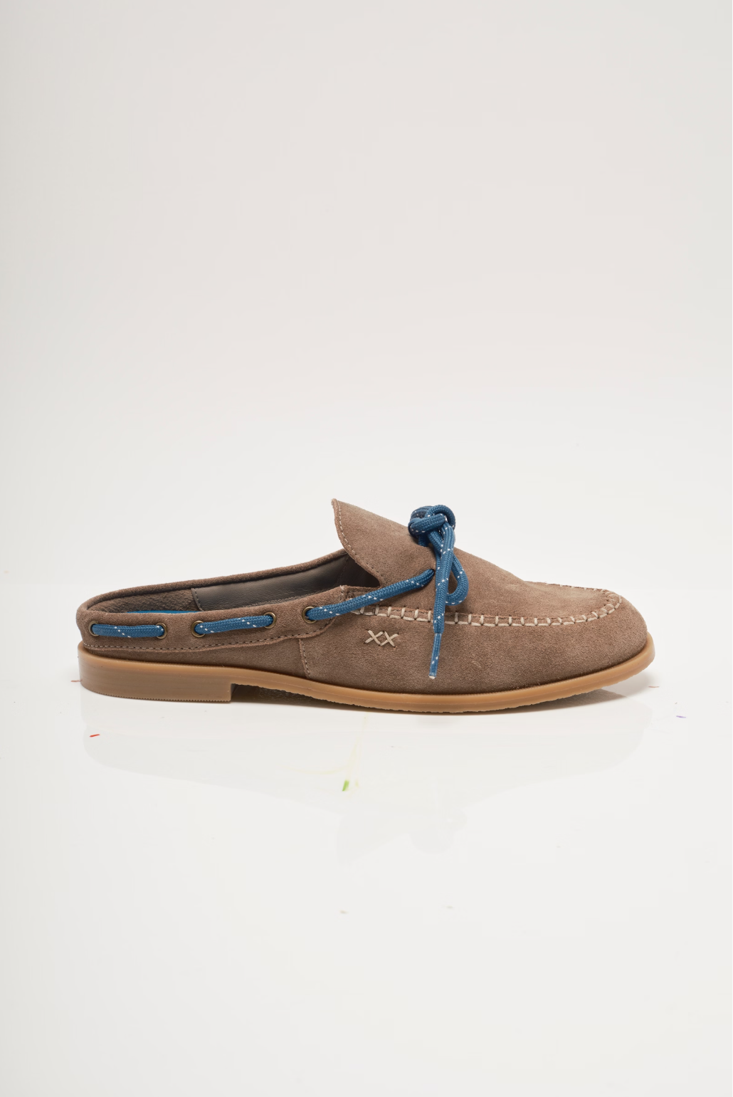 Tan suede mules with blue lace-up bow and low wooden-look sole