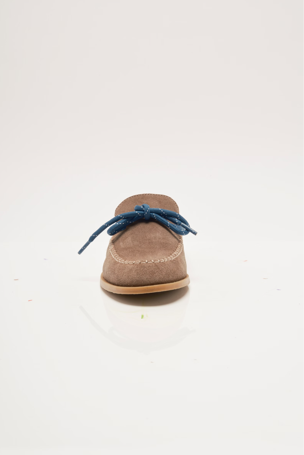 Tan suede mule with blue lace-up tie, back view