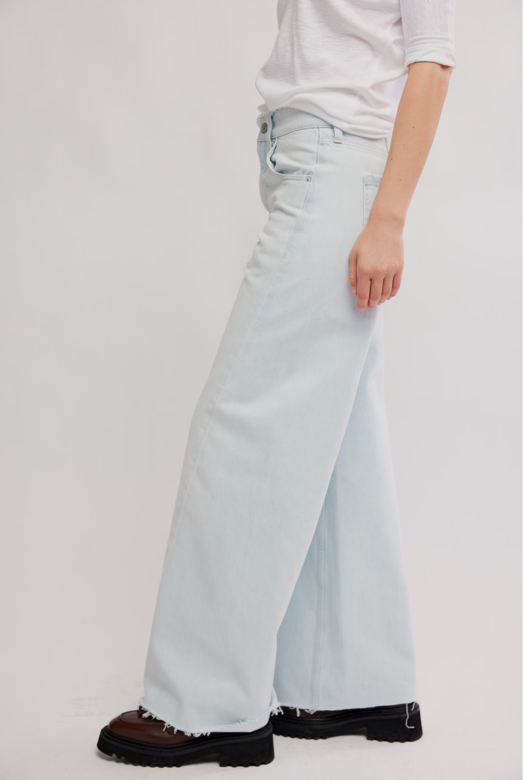Light blue wide-leg jeans with relaxed straight leg and frayed hem