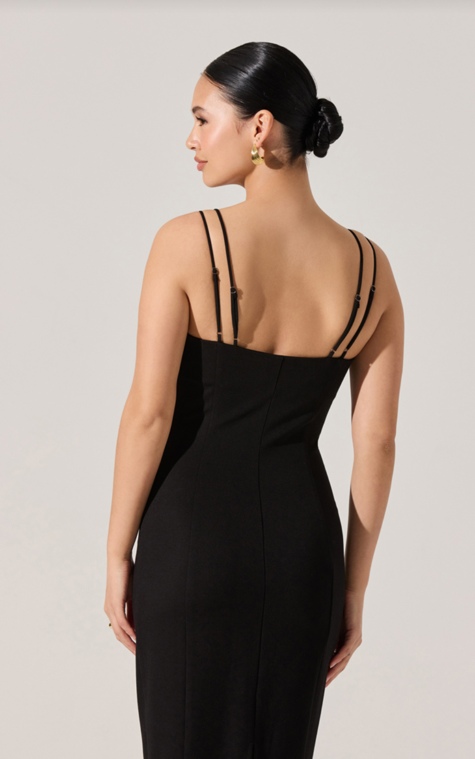 Black midi dress back view with spaghetti straps and fitted straight silhouette