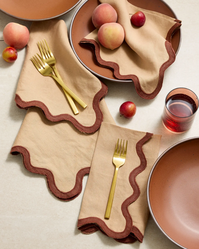 Linen napkin with scalloped edge, beige fabric and dark brown trim