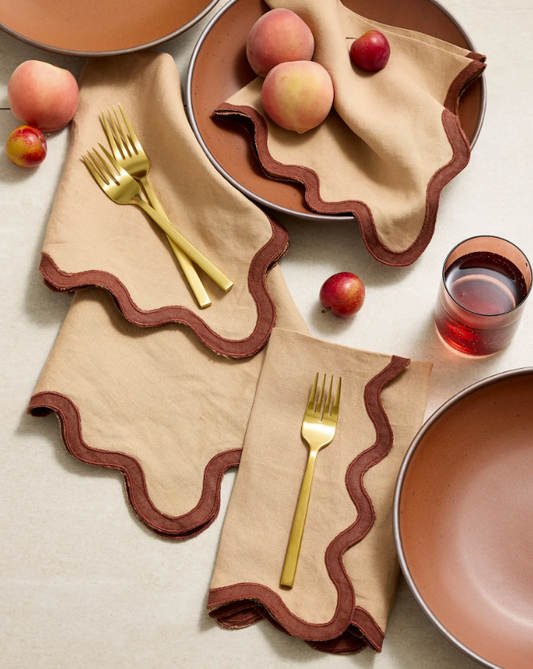 Linen napkin with scalloped edge, beige fabric and dark brown trim