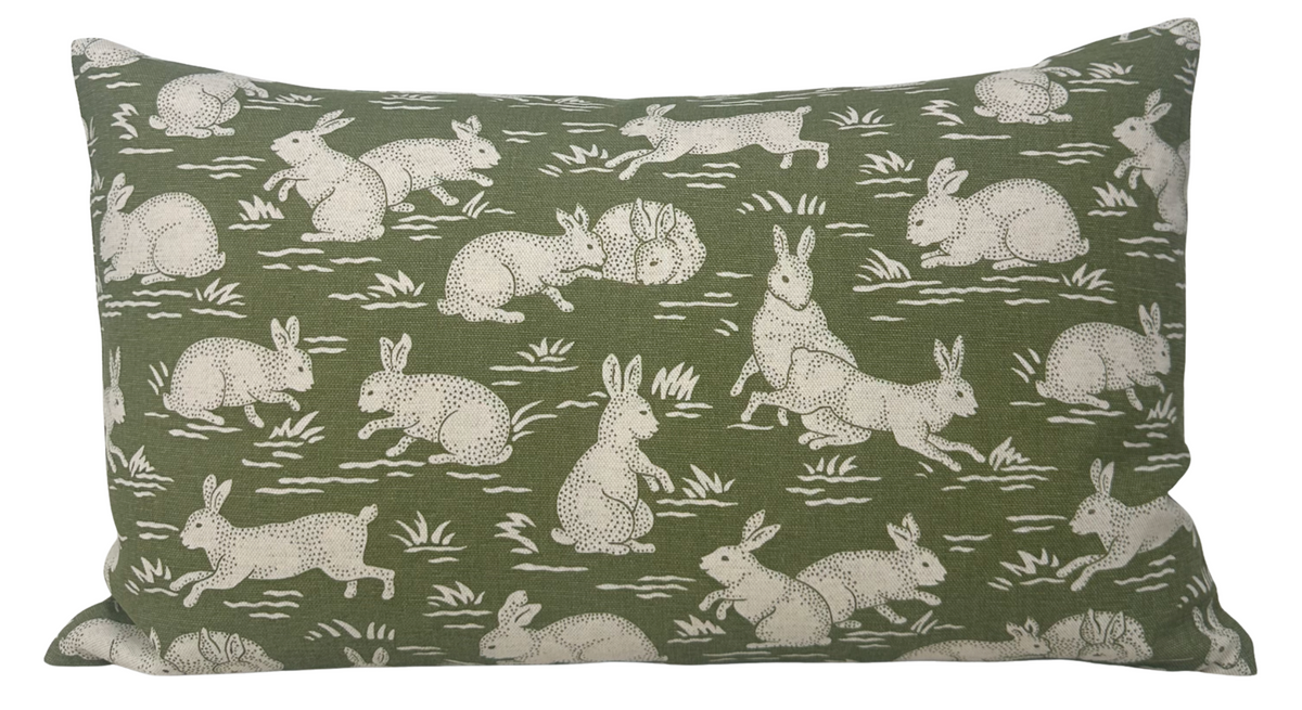 Sage green cotton pillow cover with white rabbit, hare, and grass motif pattern