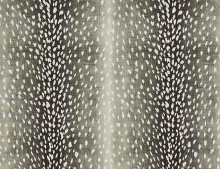 Close-up of charcoal antelope-print pillow cover with dense white speckled pattern